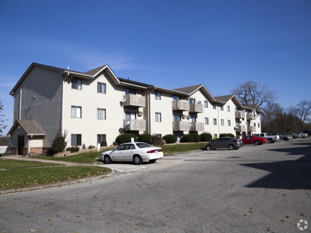 Cypress buildings and resident parking on a clear day